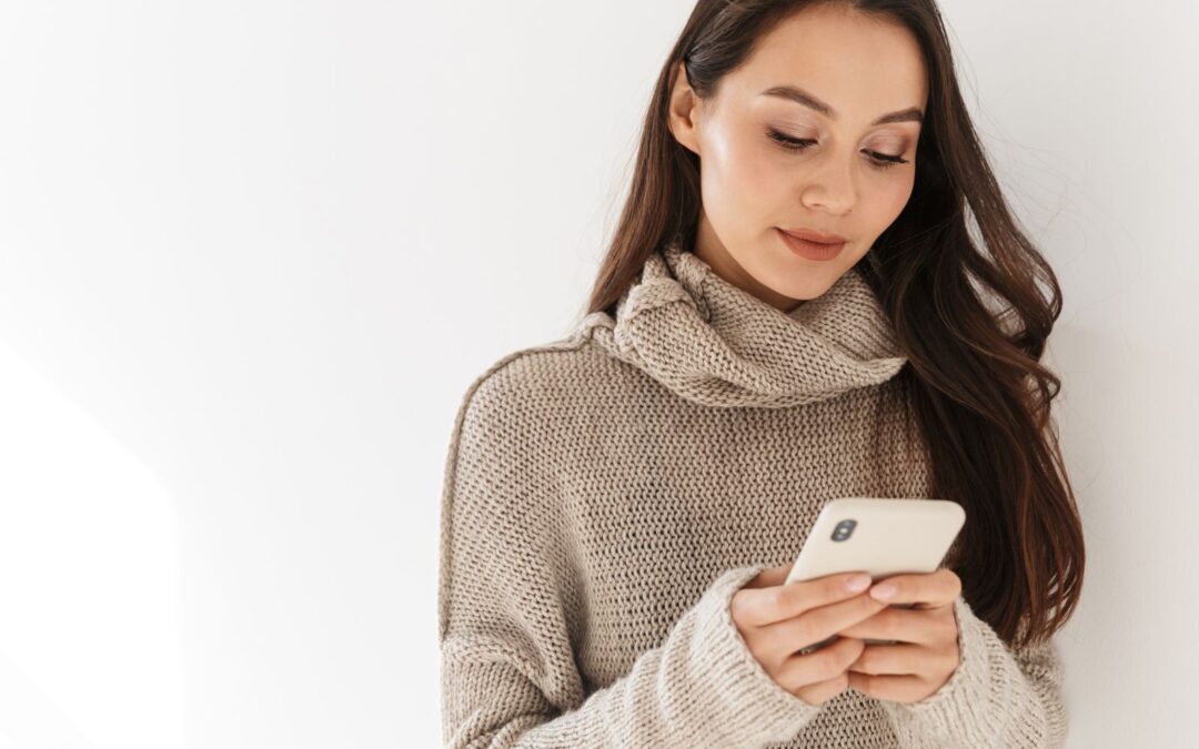 Woman looking at different abortion options on her phone