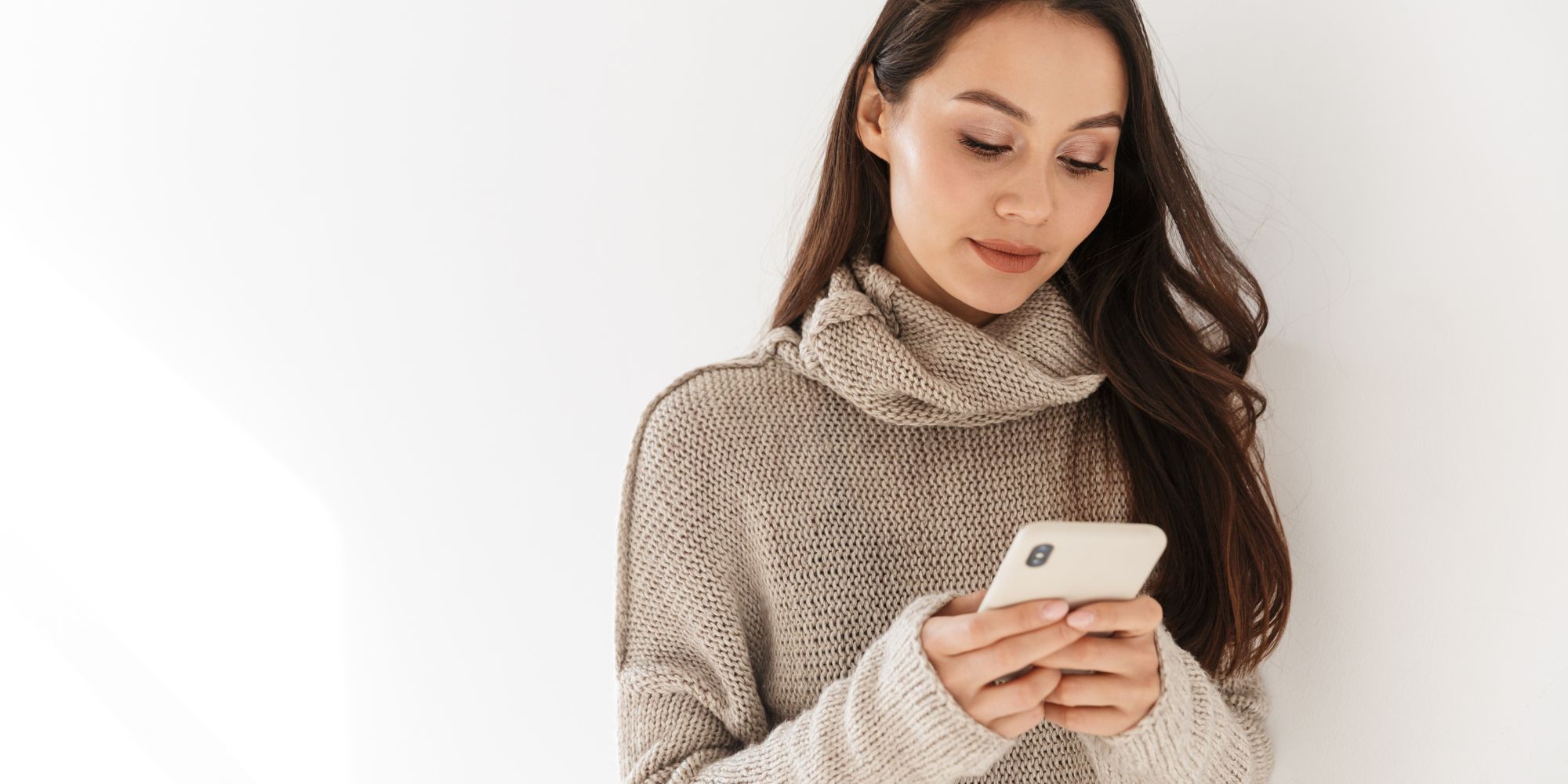 Woman looking at different abortion options on her phone
